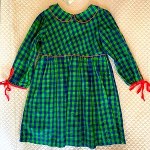 Blue and green checkered dress with Peter Pan collar and coral trim.